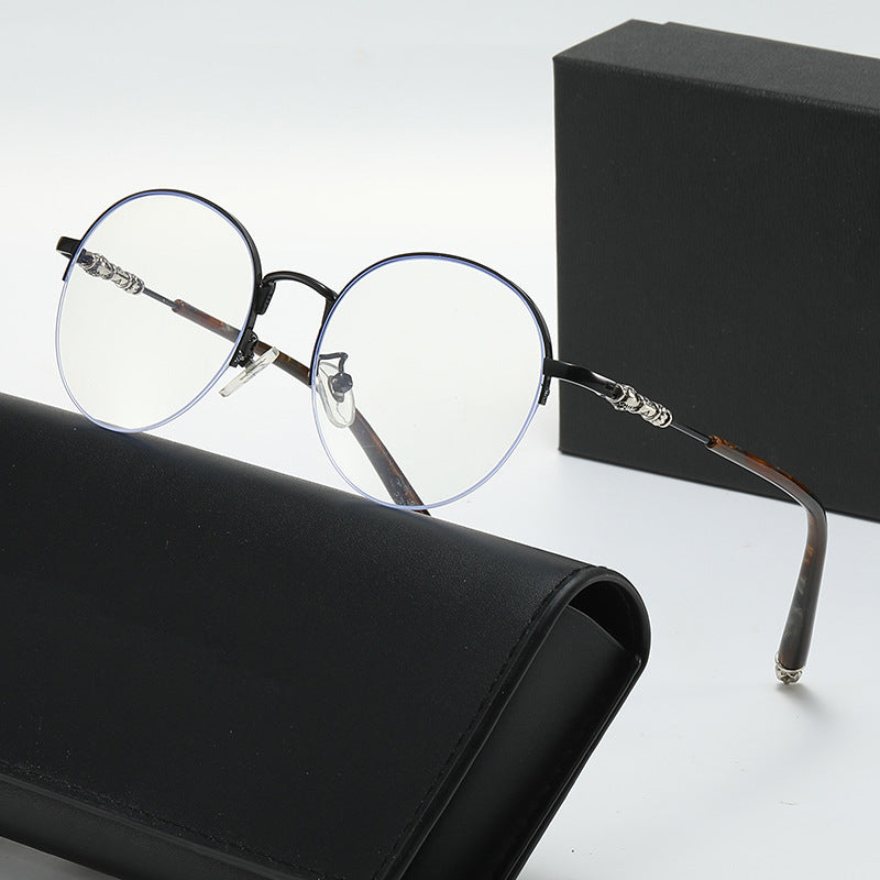 Dame rund solbrille med elegant metallramme og komfortable nesepads Skanto