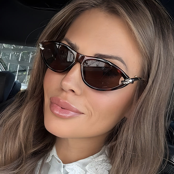 Damen Cat-Eye solbriller med elegant metallramme og beskyttende UV-filter Skanto