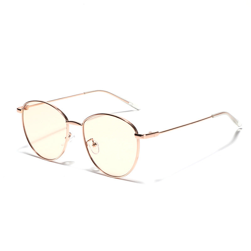 Dame rund solbrille med smal metallramme og polariserte linser Skanto