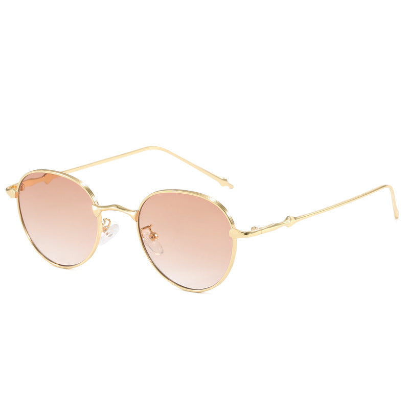 Dame elegante runde solbriller med moderne metallramme Skanto