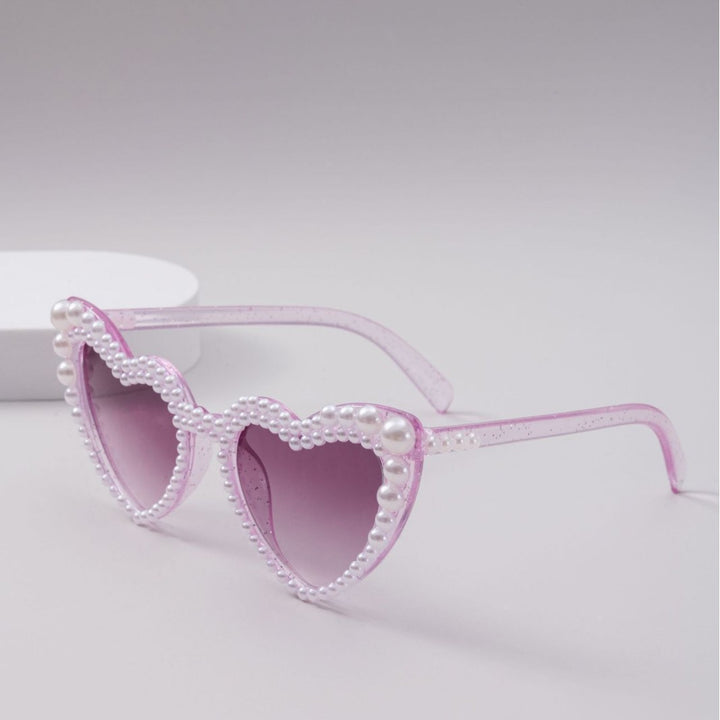 Dame designer solbrille med perleinnramming fra Skanto
