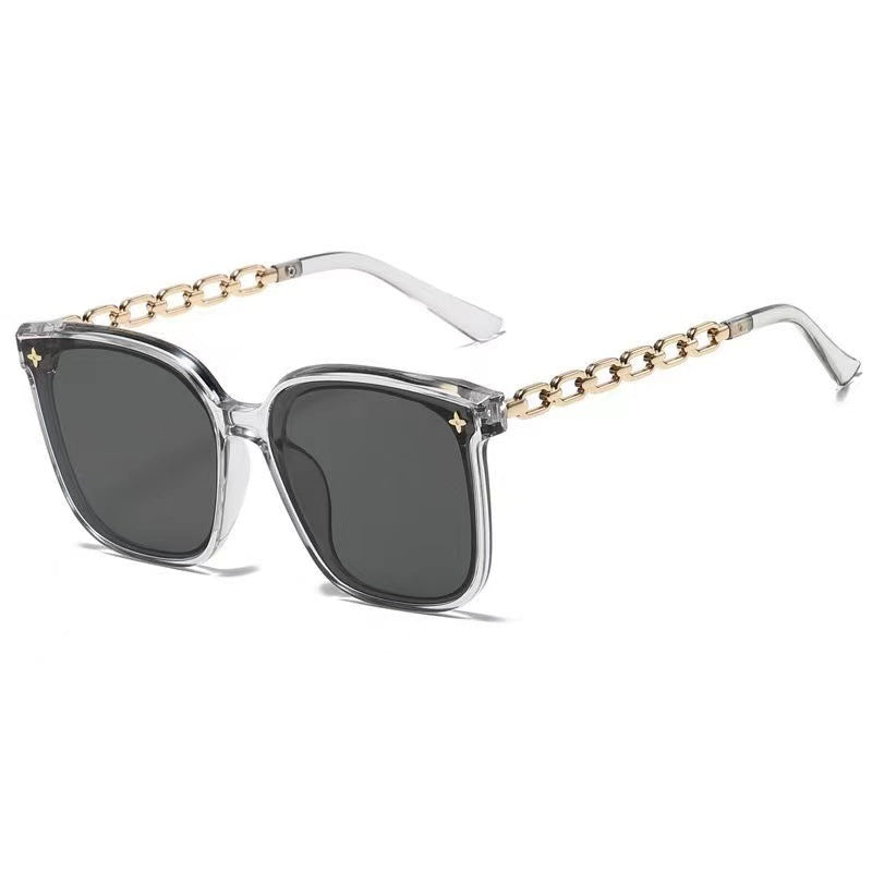 Dame ekstrastor solbrille med modig kjedeinnramming Skanto