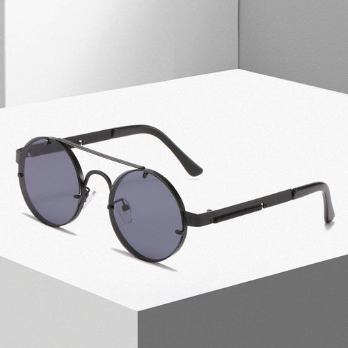 Dame rund designer solbrille med innovativ metallramme og beskyttende linser Skanto