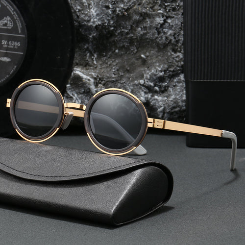 Damer moteriktig rund solbrille med elegant metallramme Skanto