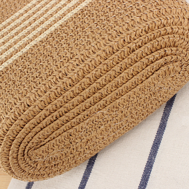 Crossbody bag made of braided natural material with contrasting stripes Skanto