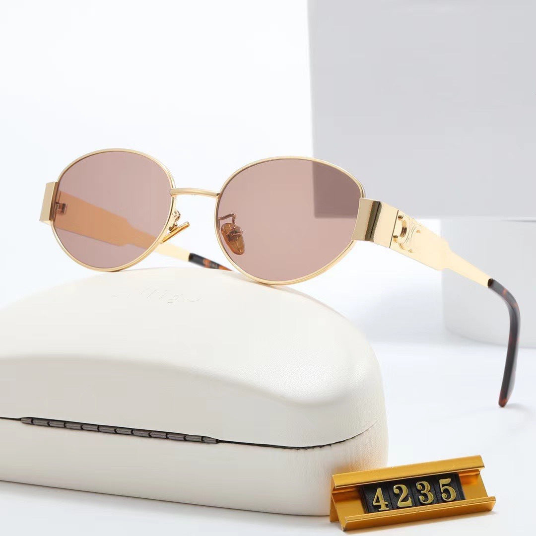 Dame elegant oval solbrille med gullfarget ramme Skanto