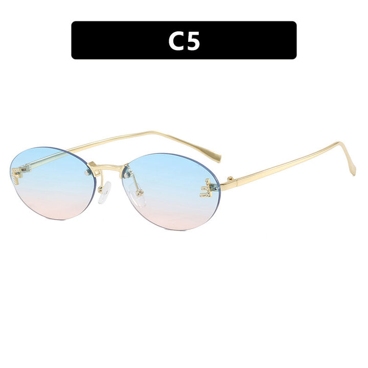 Dame mote trendy solbriller med elegante, runde glass og filigran metallramme Skanto