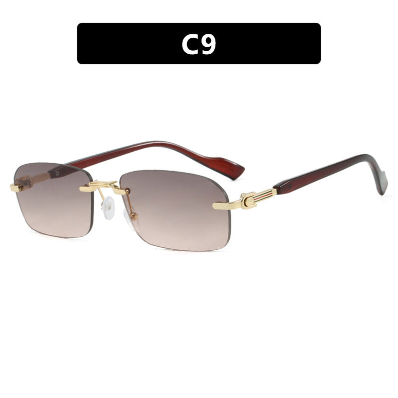 Dame solbrille med elegant metallramme og stilige tre detaljer Skanto