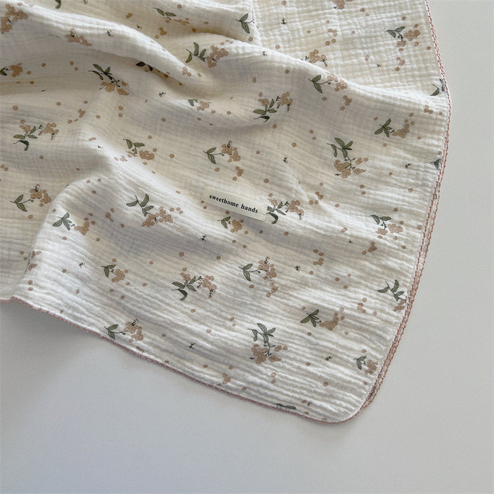Unisex allsidig muslinteppe med blomstrete detaljer Skanto