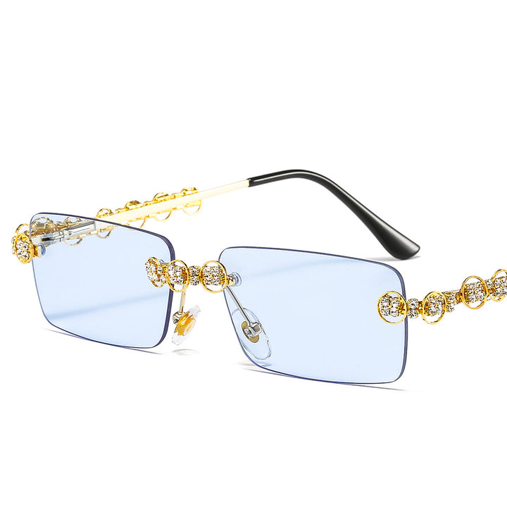Dame Designer-solbrille med glitrende ramme og rektangulært glass Skanto