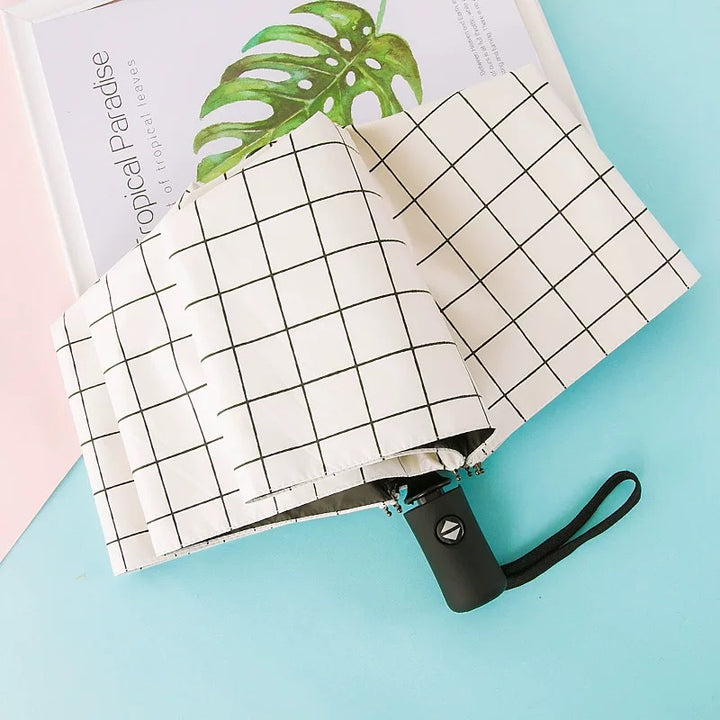 Kvinne Falt Paraply med Elegant Fjærdesign Skanto