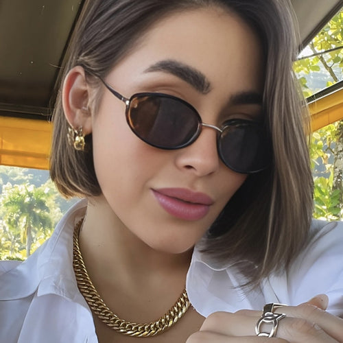 Dame moteriktig solbrille i elegant ovalt design Skanto