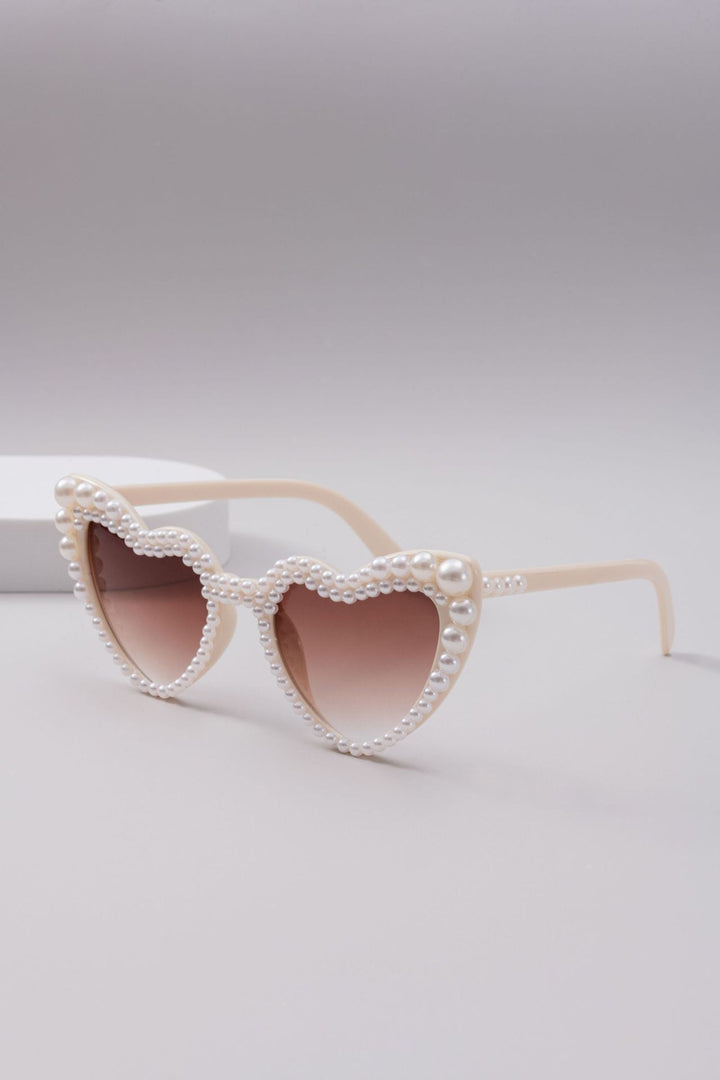 Dame designer solbrille med perleinnramming fra Skanto