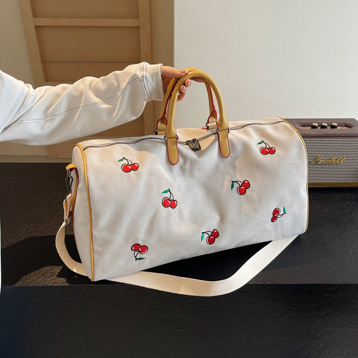 Sporty weekend bag with playful cherry pattern Skanto