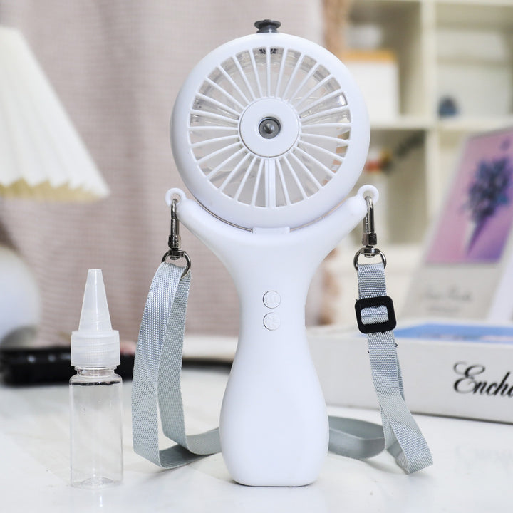 Kvinne bærbar mini håndvifte med sprayfunksjon og ergonomisk design Skanto