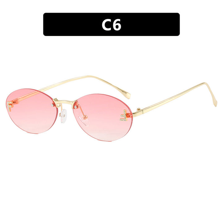 Dame mote trendy solbriller med elegante, runde glass og filigran metallramme Skanto