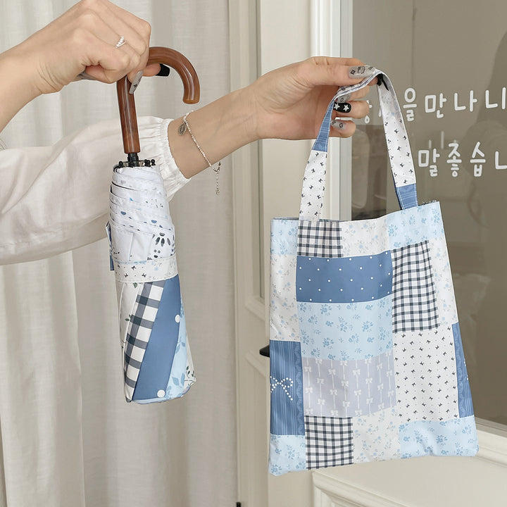 Damer paraply i romantisk patchwork-design Skanto