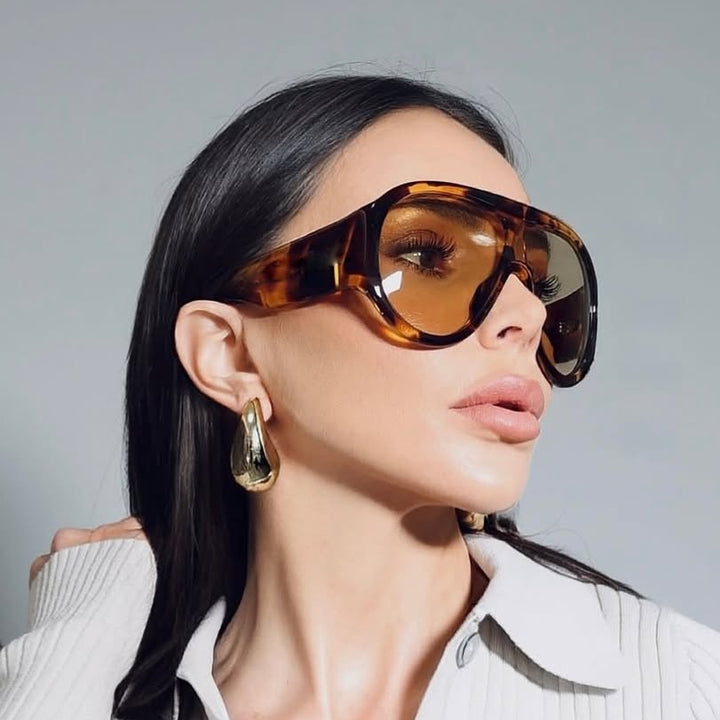 Dame oversized sports solbrille i retro-inspirert design Skanto