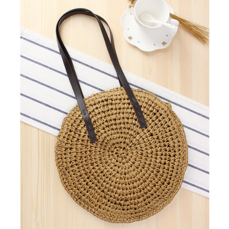 Round basket bag with sturdy leather handles Skanto