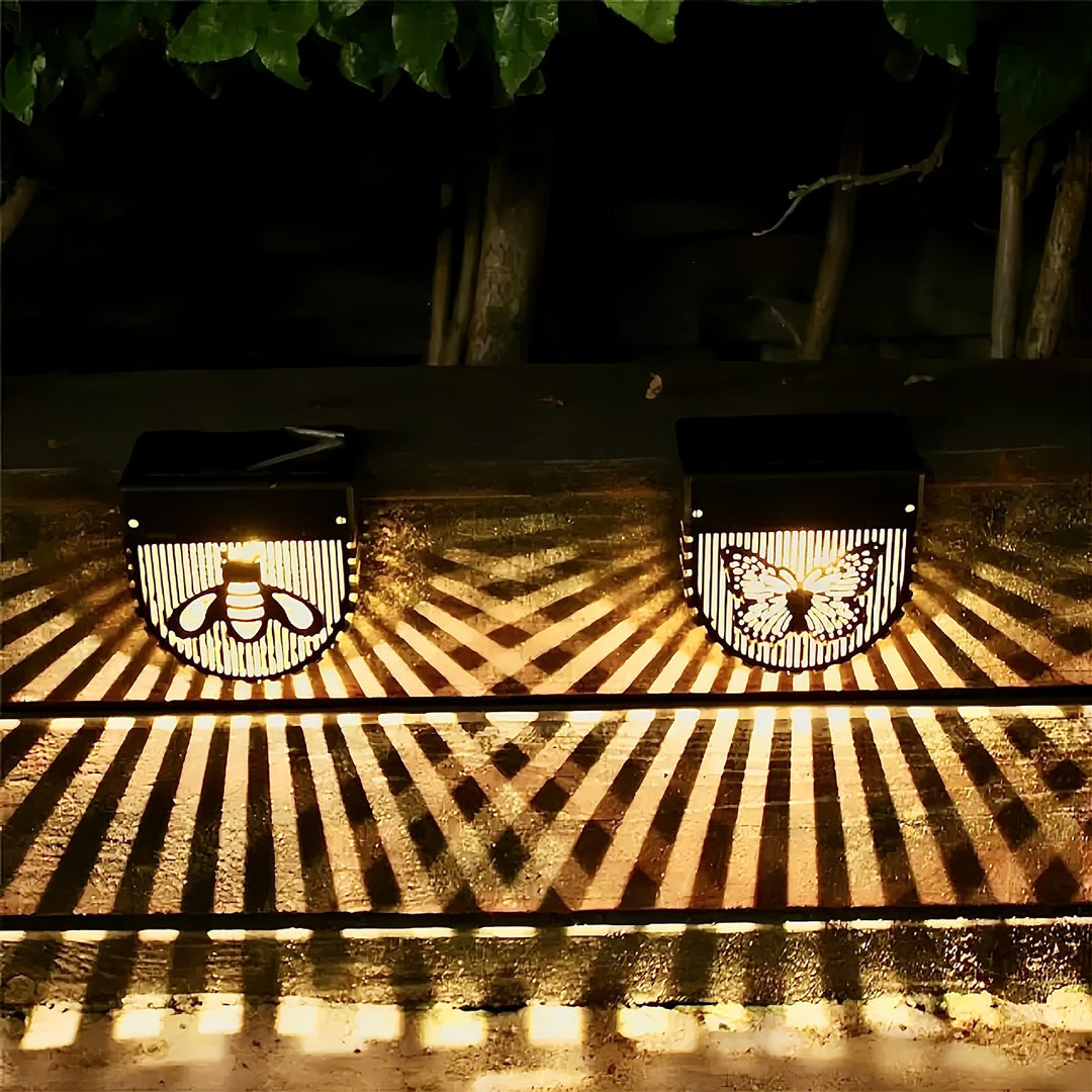 Decorative Solar-Powered Outdoor Wall Lights with Laser-Cut Insect and Flower Panels and Warm LED Ambiance Skanto