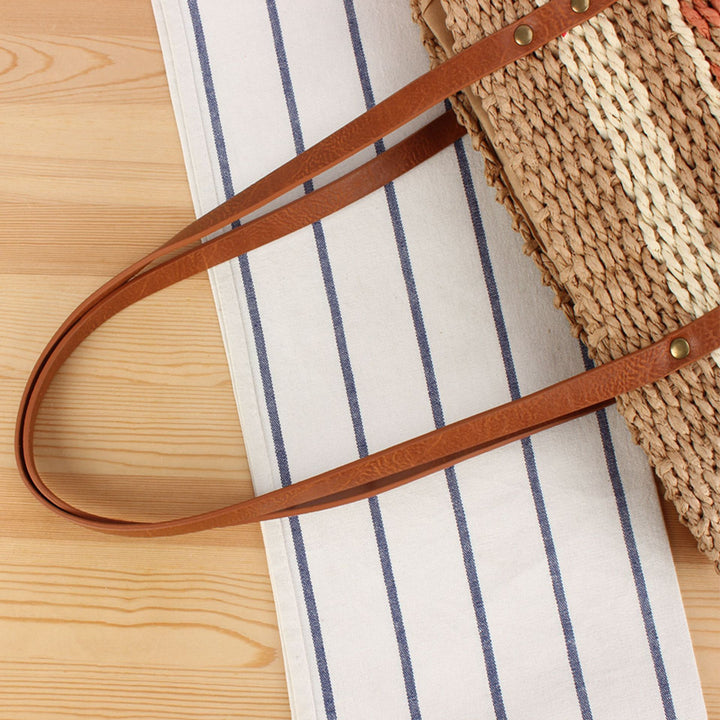 Tote bag made of woven natural material with elegant leather handles Skanto