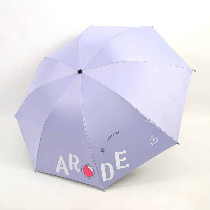 Kvinnens sammenleggbare paraply med lystig design Skanto