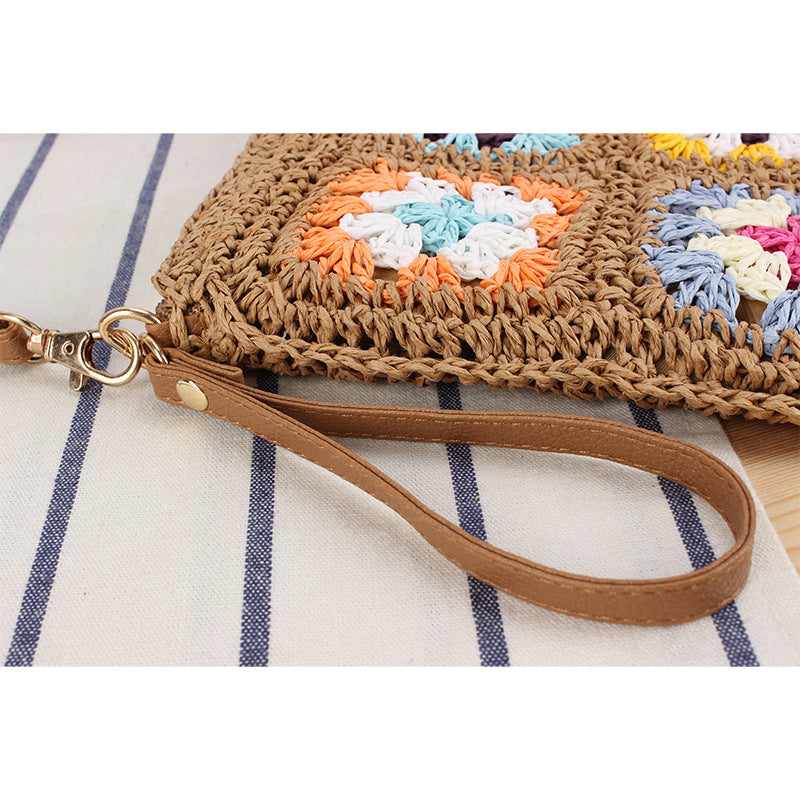 Hand-knotted shoulder bag with colorful floral design Skanto