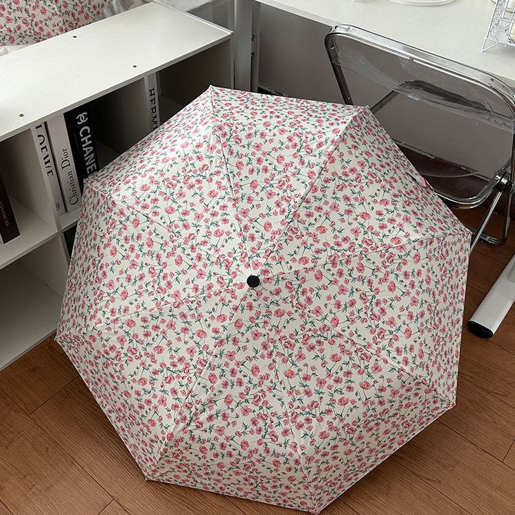 Dame sammenleggbare paraply med blomsterdesign og praktisk oppbevaringssystem Skanto