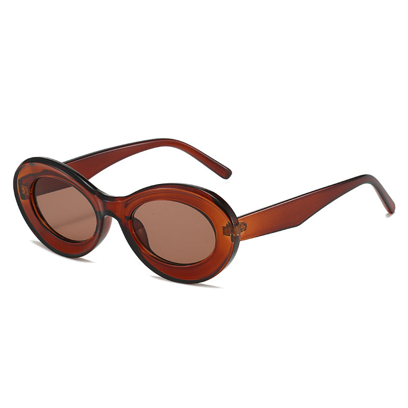Dame moteriktig solbrille i oval design Skanto
