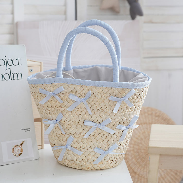 Kurvveske med delikate sløyfer og polstret kant Skanto