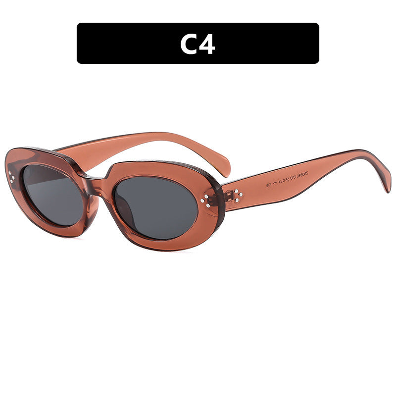 Dame moteriktig solbrille med unikt ovalt ramme og beskyttende glass Skanto