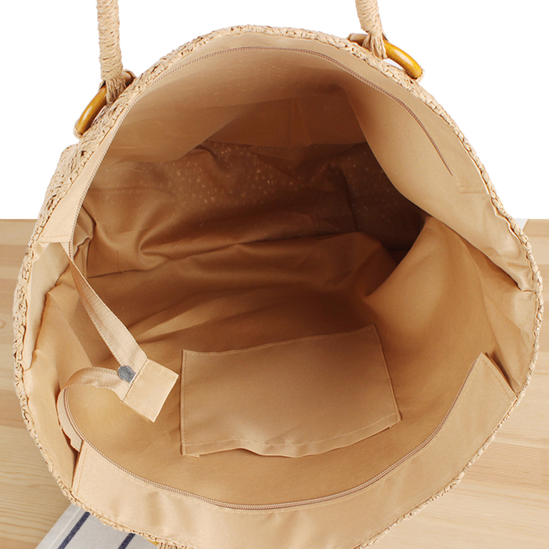 Beach bag in natural woven material with sturdy handles Skanto