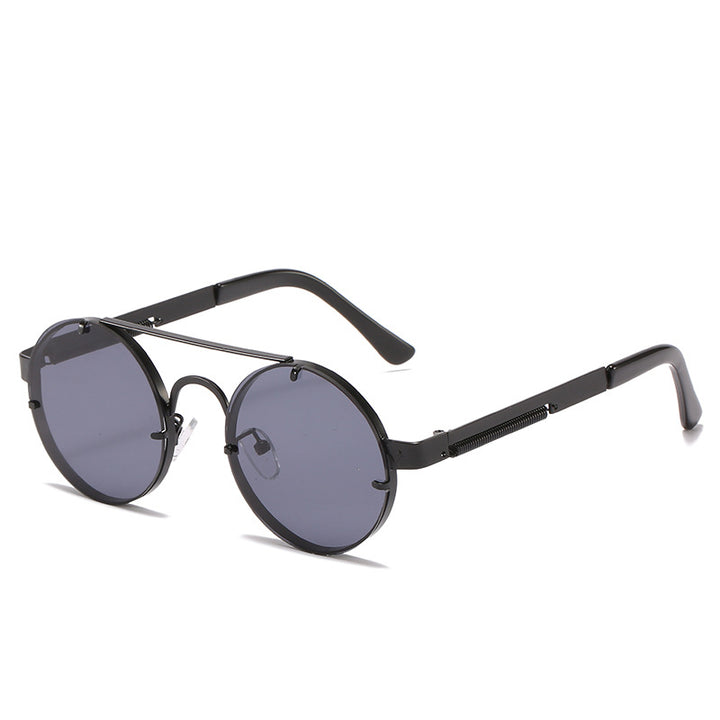 Dame rund designer solbrille med innovativ metallramme og beskyttende linser Skanto
