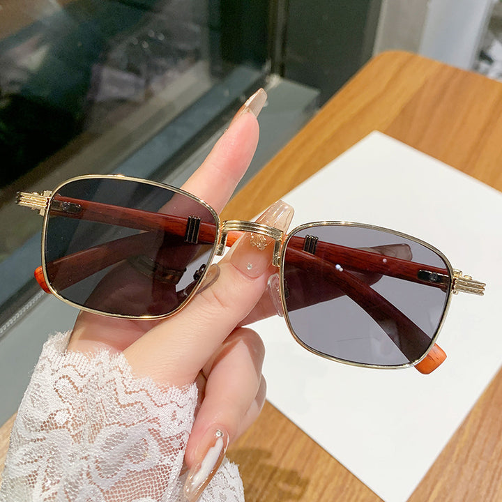 Dame solbrille med luksuriøs treinnfatning Skanto
