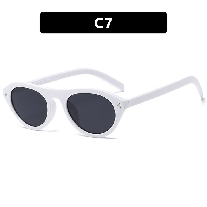 Dames moteriktig solbrille med buet ramme og beskyttende UV-filter Skanto