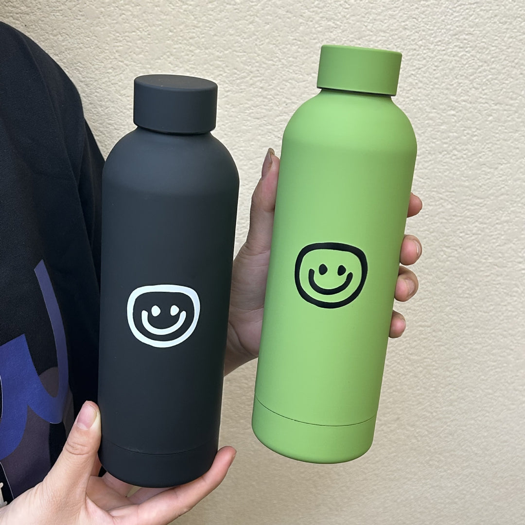 Dame isolasjonsflaske med glad smiley-design Skanto