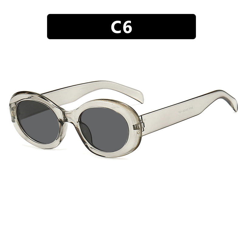 Dame moteriktig solbrille i original oval design med transparent ramme og UV-beskyttelse Skanto