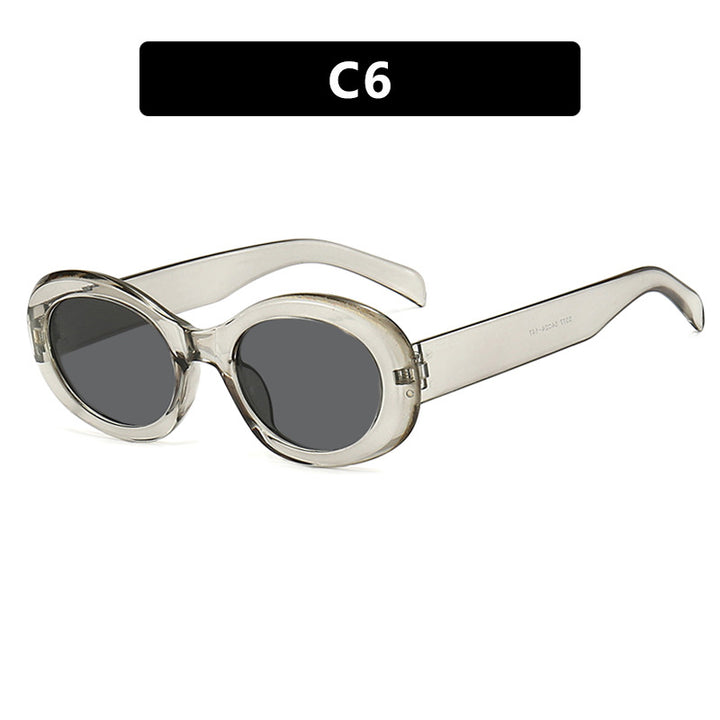 Dame moteriktig solbrille i original oval design med transparent ramme og UV-beskyttelse Skanto