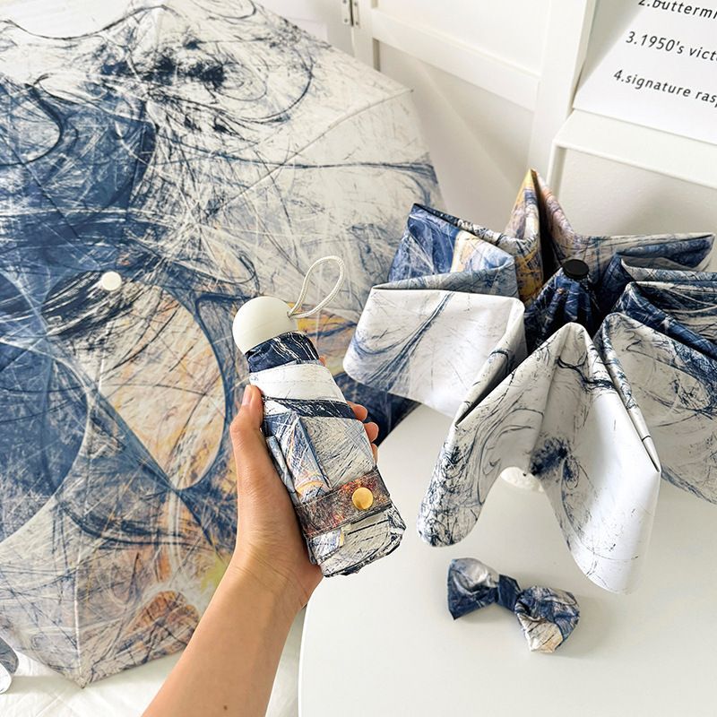 Dame sammenleggbart paraply med kunstnerisk design og automatisk åpne mekanisme Skanto