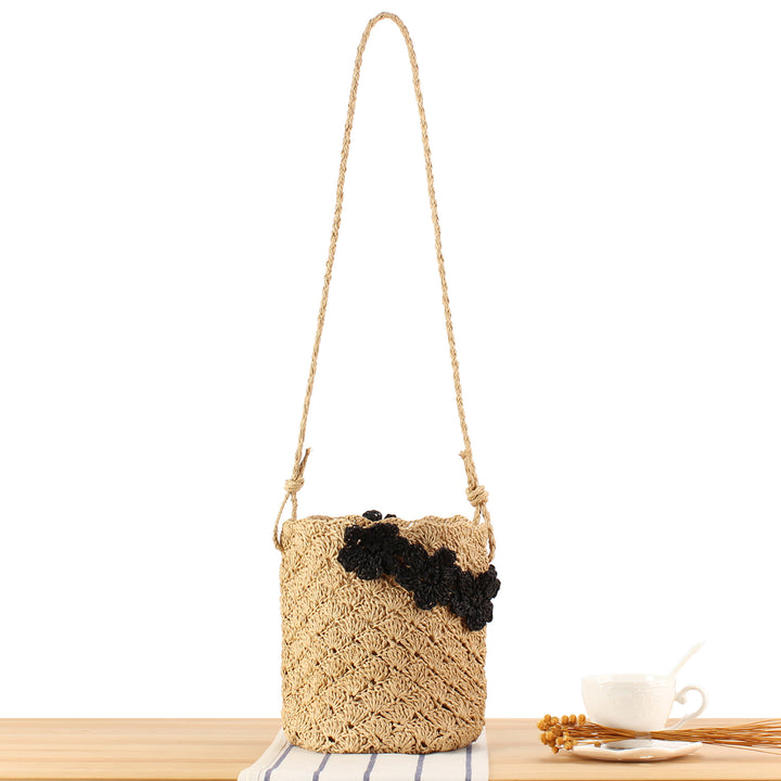 Handbag made of hand-knotted natural material with floral application Skanto