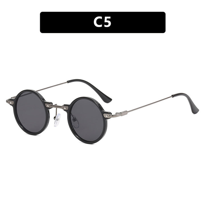 Dame rund solbrille med moderne metallramme og store blå linser Skanto