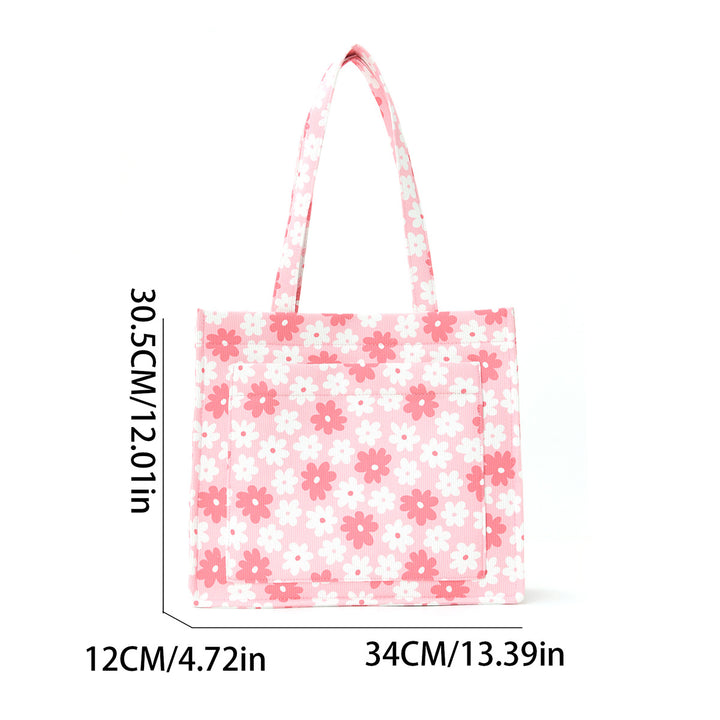 Trendete handlepose med blomsterdesign Skanto