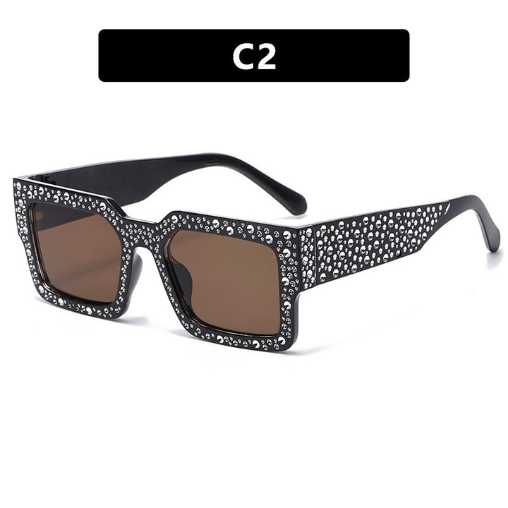 Dame ekstravagant solbrille med glitrende aksent Skanto