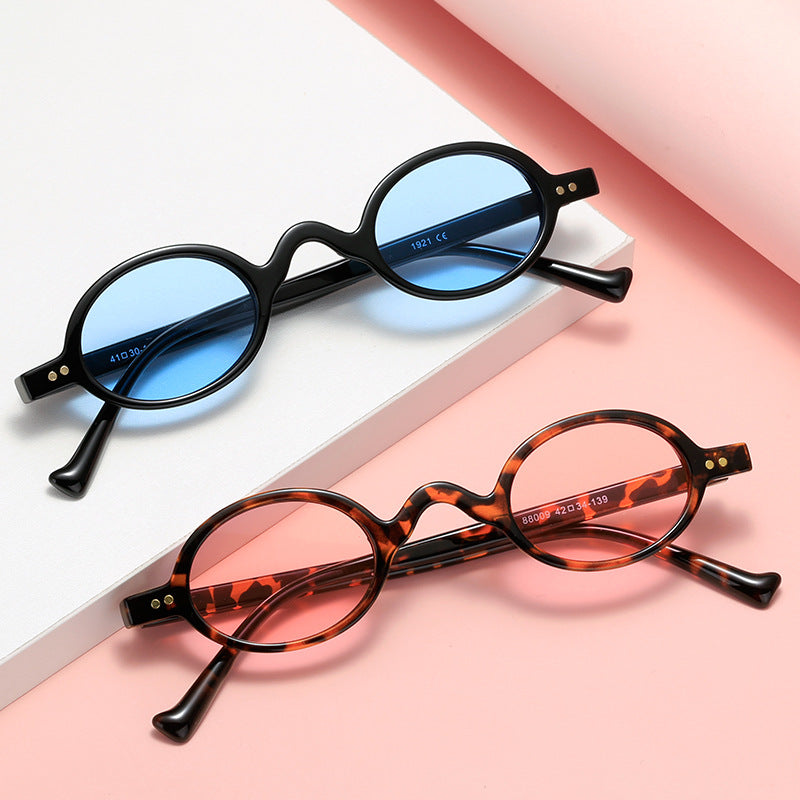 Dame rund solbrille i retrostil Skanto
