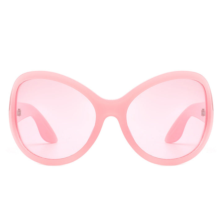 Dame solbriller i stilrent sommerfugldesign med UV-beskyttelse og bred ramme Skanto