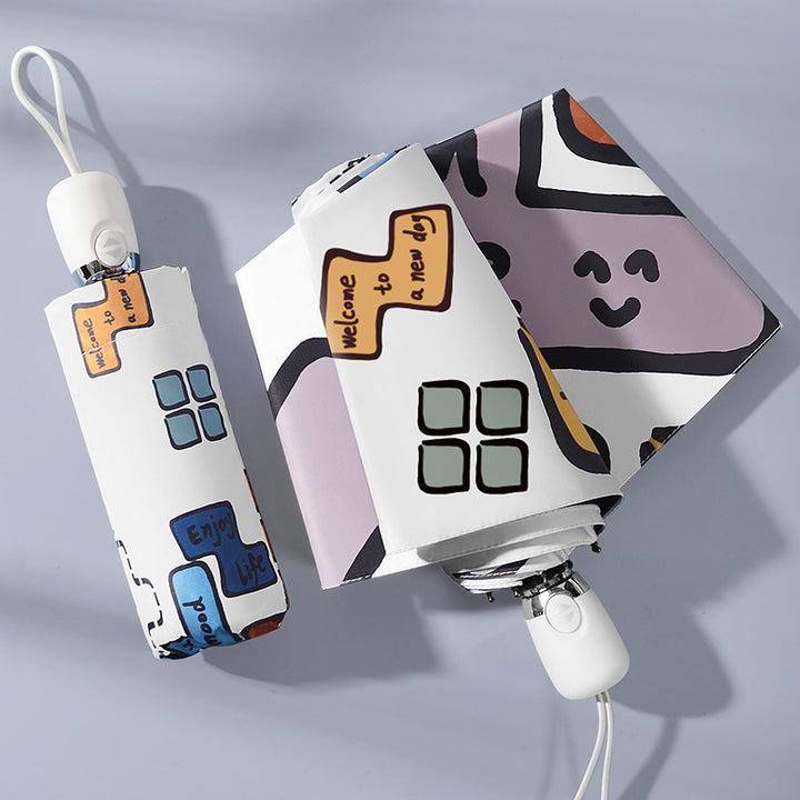 Dame sammenleggbar paraply med unikt grafisk design Skanto