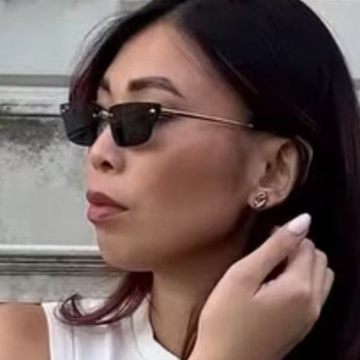Dame geometrisk solbrille med filigranramme og transparente glass Skanto