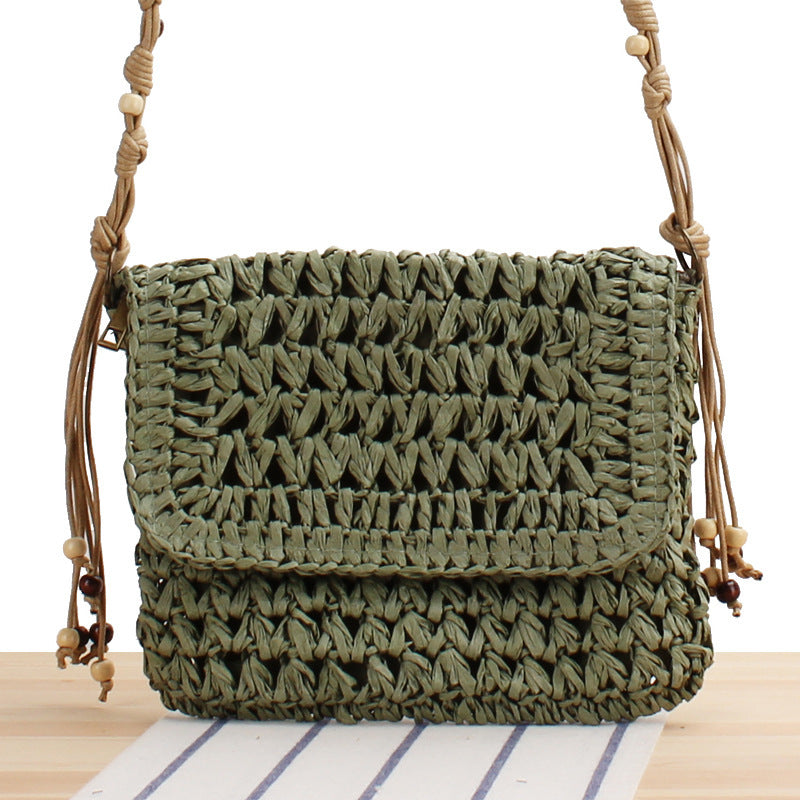 Woven natural material handbag with playful fringes Skanto