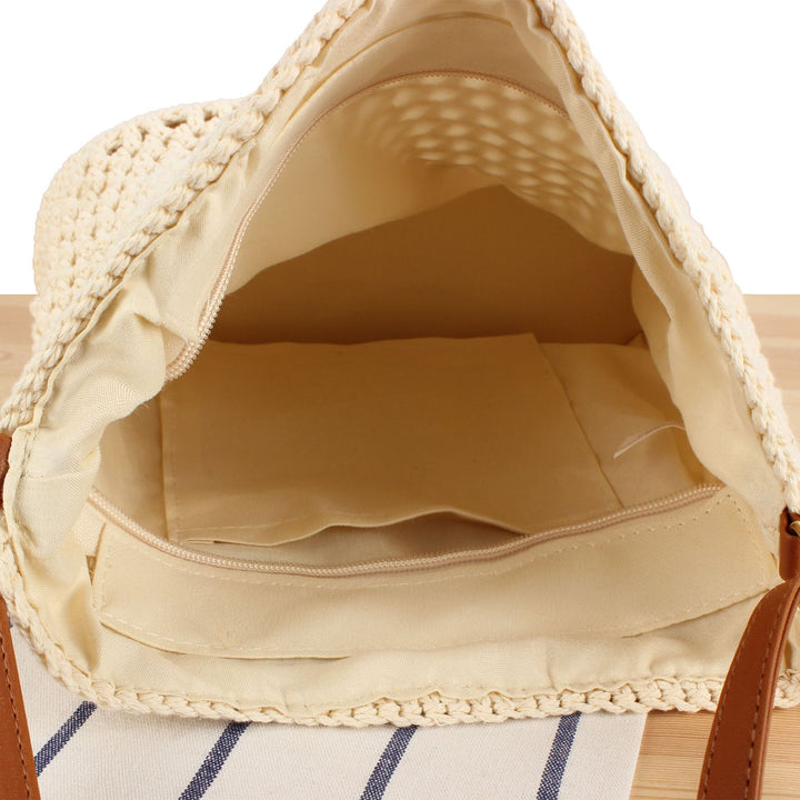 Handbag in hand-woven natural material with leather accents Skanto