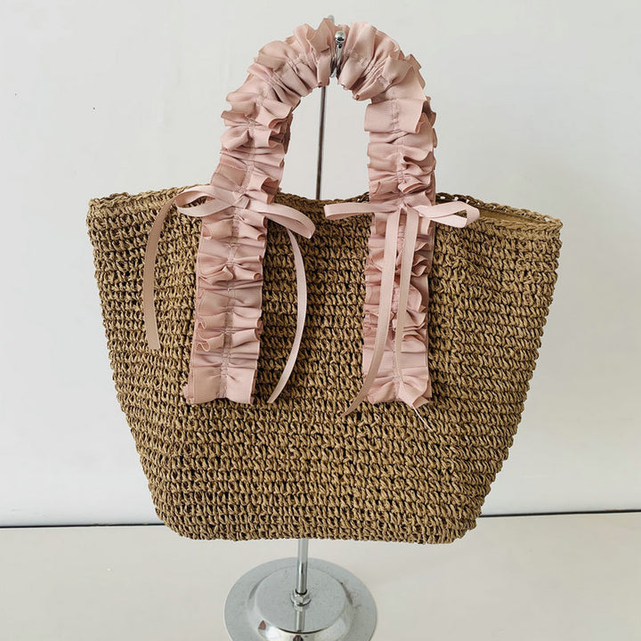 Heklet strandveske med elegante satinfinesser Skanto